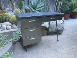 Compact Mid Century Metal Deck w Formica Top. Measures 40” wide by 21” deep and 29” to desk height. Body of desk...