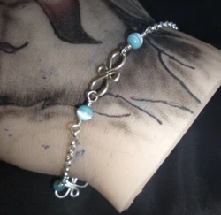 Acid tested for purity! This beautiful bracelet has a very nice design and the beads are a baby or sky blue with a...