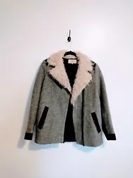 Grey Zara wool shearling jacket with black contrast and lining.  Has a hole in the pocket. Size medium.