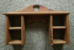 With 4 Storage Cubby Holes. Has 2 Brass Pegs. Hanging Wall Display Heart Cutouts. Display this nice ole classic as it...