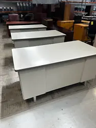W/ White Laminate Top and Gray Trimming. used desk, w/ normal wear & tear, in good overall condition. Box/Box/Box on...