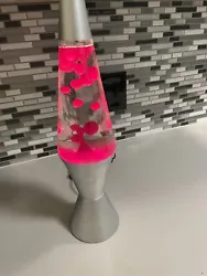 Nice clear original bottle, clear liquid with bright pink lava. Lamp works great!
