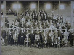 Interestingly there is a very young fellow in the left front dressed in knickers with a saxophone in his left hand....
