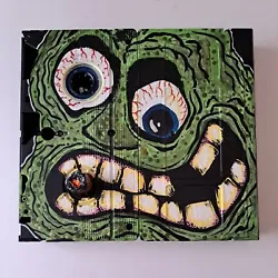 Original VHS Tape Head #4 in series sold by Artist lowbrow outsider art by Adam John Mulcahy. Acrylic paint on VHS tapes