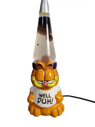 Up for sale is a vintage 1999 Garfield The Cat lava lamp, featuring the iconic cartoon character in a fun and colorful...