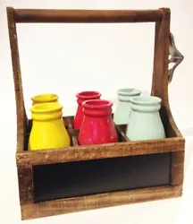 WOODEN CARRIER WITH COLORFUL CERAMIC MILK BOTTLES W/ BOTTLE OPENER ON THE SIDE. GREAT CONDITION. A LITTLE RUST ON...