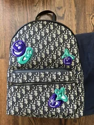 Brand new men’s Dior X Kenny Scharf backpack. Material: Jacquard CanvasThe bag come with original dust bag but no...