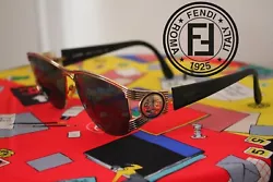 Beautiful vintage 1990s Fendi goldtoned sunglasses with signature Janus head logo.