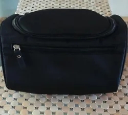 A new travel, toiletry, organizer bag. Portable, waterproof Nylon, able to hang off a door or knob using the hook.