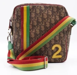 This authentic vintage Christian Dior by John Galliano shoulder bag features a brown monogram rasta pattern on PVC...
