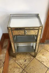 mirrored nightstand. Item is in very good condition