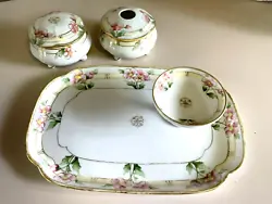 It is hand painted and marked Nippon on the bottom of all of the pieces. The hair receiver, Dresser or power box...