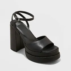 •4.75in platform-heel pumps •Contoured vamp band •Faux-leather construction •Round open-toe and open-back...