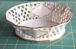 This dish is perfect for storing trinkets or sweets and will be adecorative piece in any room. in gold on the base,...