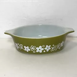 Produced by Pyrex between 1972-1979. One small chip present on one handle (a little rough to the touch, but not sharp).