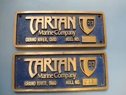 Two Bronze builders plaques for a Tartan 27 Sailboat. One has a blank hull # and one has #711.