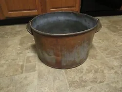 Large vintage brass copper metal pot with handles is in good shape. Measures 9