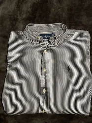 This classic black and white striped button-up shirt by Ralph Lauren is a must-have addition to any mans wardrobe....