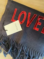 New, authentic Gucci scarfNavy blue Red sequin lettering. Says “LOVED”51% silk, 49% cashmere9.75 x...