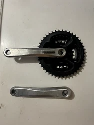 Shimano FC-M151 Triple Mountain Bike Crankset. Arms are 170 mm long. Chainrings are 42t/34t/24t. Fits a square taper...