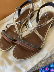 Louis Vuitton gold and logo sandals. Very pretty and comfy…putting two houses of wardrobes together and just way too...