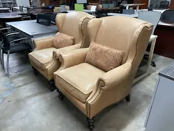 Tommy Bahama wing back leather chairs, price include both chairs pictured