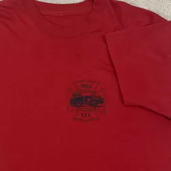 Good used condition. Has a few marks and stains on front and back. Could use a wash. Small hole on front. Graphic is in...