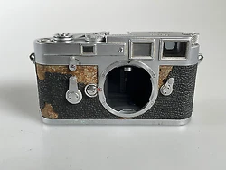 This Listing is for a Used Leica M3 SS Single Stroke Model Rangefinder 35mm Film Camera. AS IS. Does not function....