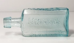 Bottle was hand blown into a hinged mold (note diagonal seam on base) finished with a hand tooled lip.