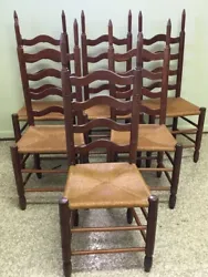Add a touch of vintage charm to your dining room with this set of six beautiful ladder back dining chairs. Crafted with...
