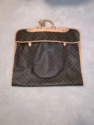 This is a 2014 Louis Vuitton garment bag in really great condition. There is a very nice, even patina with only one...
