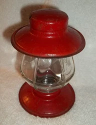 Container has a red painted tin top and bottom. The glass is marked T H Stouch Co Jeannetter PA Patent App on bottom.