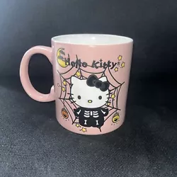 Add a touch of Halloween spirit to your morning coffee with this Sanrio Hello Kitty Skeleton Pink Spiderweb Mug....
