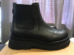 Stomp on any terrain with these sturdy lug sole chelsea boots designed with water-resistant coating. Chelsea boot....