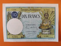 Banque de Madagascar. Type Billet courant. Valeur 10 francs (10 MGG). Dix Francs. 1 paire de trou dagrafeuse. Dates...