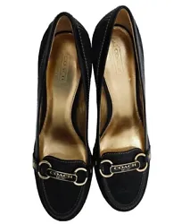 Elevate your style with these chic Designer Coach pumps heels shoes . The black faux leather upper features a signature...