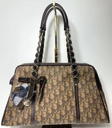 Preowned DIOR shoulder bag.Normal wear.Good condition.Dior trotter coated canvas monogram in the dark and light brown....
