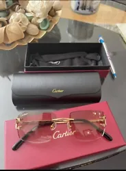 Cartier sunglasses ( brown lense ) pre owned but in great condition please ask questions if need be check my feedback...