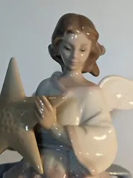 Porcelain Tree Topper #6132. Lladro Angle of the Stars.