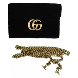 Features Black, quilted shoulder bag, GG Marmontmodel from Gucci. Made of velvet. Decorated with a logo. Detachable...