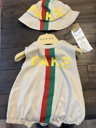 Gucci Onsie and matching hat for babySize 0-3monthsAuthentic used once