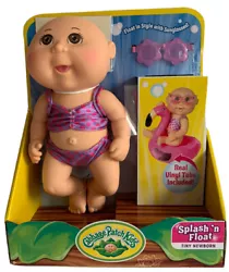 Set includes: Doll, 2 piece swimsuit, sunglasses, flamingo vinyl tube and birth certificate.