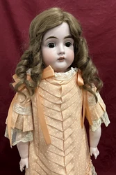 Here is a LOVELY and large antique bisque child doll made by Kestner, mold number 166. She has large dark brown glass...
