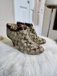 Size 8. These Coach Bennett booties feature round toes, high stiletto heels and gold buckled accents, which add a touch...