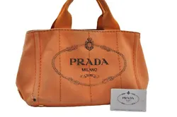 Item No. 4479G. Material Canvas. Color Orange. Pocket Inside Pocket has dingy,rubbed,a little dirt. Style Hand bag. S...