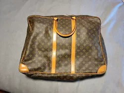 LOUIS VUITTON SoftSided Suitcase crafted of Louis Vuitton signature Monogram on toile canvas features two vachetta...