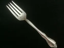The fork is hallmarked with a lion, an anchor, and a 