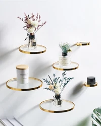 Elevate decor with our 3-pack Circular Glass Shelves. Luxurious gold-rimmed design in 3 sizes: 9x9x2in, 7x7x2in, and...