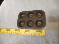Here is what I believe is a salesman sample muffin pan. This weighs 1-4.3 oz. and is 6 