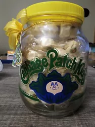 Cabbage Patch Kids Glass Candy Jar With Original Candy. Brand new from 1984 with original lemon flavored candies...